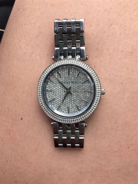 michael kors watch with diamonds around it|Michael Kors silver diamond watch.